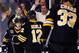 BOSTON, MA - JANUARY 20: Torey Krug #47 of the Boston Bruins is congratulated by teammates after scoring a goal in the first period against the Los Angeles Kings during the game at TD Garden on January 20, 2014 in Boston, Massachusetts. (Photo by Jared Wickerham/Getty Images)