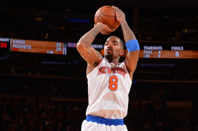 J.R. Smith Plays Air Guitar During Halftime Act