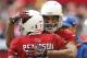 Arizona Cardinals wide receiver Larry Fitzgerald embraces teammate Patrick Peterson during the first half of an NFL football game against the St. Louis Rams , Sunday, Dec. 8, 2013, in Glendale, Ariz. (AP Photo/Rick Scuteri)