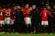 MANCHESTER, ENGLAND - JANUARY 22: David Moyes the Manchester United manager speaks with his players prior to extra time during the Capital One Cup semi final, second leg match between Manchester United and Sunderland at Old Trafford on January 22, 2014 in Manchester, England. (Photo by Laurence Griffiths/Getty Images)