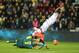FILE - In this Dec. 24, 2013 file photo, Monaco’s forward Falcao falls as he tries to reach the ball during a challenge with Nantes' defender Isaa Cissokho and goalkeeper Remy Riou during their French League One soccer match in Nantes, France. Falcao was injured this Wednesday, Jan. 22, 2014 during a French Cup game against Chasselay. (AP Photo/David Vincent, File)