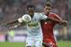 Bayern's Mario Mandzukic of Croatia, right, and Moenchengladbach's Raffael of Brazil challenge for the ball during the German first division Bundesliga soccer match between FC Bayern Munich and Borussia Moenchengladbach in Munich, Germany, Friday, Aug. 9, 2013. (AP Photo/Kerstin Joensson)
