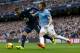 Manchester City's Alvaro Negredo, right, fights for the ball against Tottenham's Kyle Walker during their English Premier League soccer match at the Etihad Stadium, Manchester, England, Sunday Nov. 24, 2013. (AP Photo/Jon Super)