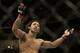 Benson Henderson gestures while fighting Gilbert Melendez in a UFC lightweight championship mixed martial arts fight in San Jose, Calif., Saturday, April 20, 2013. Henderson won by split decision to retain the championship. (AP Photo/Jeff Chiu)