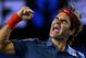 Roger Federer of Switzerland celebrates after defeating Andy Murray of Britain during their quarterfinal at the Australian Open tennis championship in Melbourne, Australia, Wednesday, Jan. 22, 2014.(AP Photo/Aaron Favila)