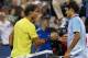 CINCINNATI, OH - AUGUST 16: (L-R) Rafael Nadal of Spain shakes hands at the net with Roger Federer of Switzerland after their Men's Singles quarterfinals match during the Western & Southern Open on August 16, 2013 at Lindner Family Tennis Center in Cincinnati, Ohio. (Photo by Ronald Martinez/Getty Images)