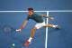 MELBOURNE, AUSTRALIA - JANUARY 22: Roger Federer of Switzerland plays a forehand in his quarterfinal match against Andy Murray of Great Britain during day 10 of the 2014 Australian Open at Melbourne Park on January 22, 2014 in Melbourne, Australia. (Photo by Clive Brunskill/Getty Images)