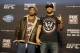 Mixed martial Arts fighters Benson Henderson, left, poses for a photo with Josh Thomson during a media availability at the United Center for his upcoming UFC fight, Thursday, Jan. 23, 2014, in Chicago. The pair are slated to battle on Saturday. (AP Photo/Nam Y. Huh)