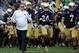 Notre Dame coach Brian Kelly runs onto the field with his team prior to a in a NCAA college football game with Michigan State Saturday Sept. 21, 2013 in South Bend, Ind. (AP Photo/Joe Raymond)
