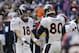 Denver Broncos' Peyton Manning (18) celebrates with Julius Thomas (80) and other teammates after he threw a pass for a touchdown against the Houston Texans during the third quarter of an NFL football game, Sunday, Dec. 22, 2013, in Houston. (AP Photo/David J. Phillip)
