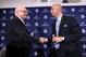 Jan 11, 2014; State College, PA, USA; James Franklin (right) shakes hands with Penn State University Athletic Director David Joyner (left) after James Franklin is announced as the Penn State Nittany Lions new head coach during a press conference at Beaver Stadium. Mandatory Credit: Matthew O'Haren-USA TODAY Sports