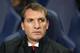 Liverpool's manager Brendan Rodgers sits in the technical area prior to kick off for their English Premier League soccer match between Tottenham Hotspur and Liverpool at the White Hart Lane stadium in London, Sunday, Dec.15, 2013. (AP Photo/Alastair Grant)