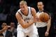 Brooklyn Nets' Mason Plumlee (1) looks to pass against the Detroit Pistons during a preseason NBA basketball game on Saturday, Oct. 12, 2013, in New York. (AP Photo/Kathy Kmonicek)