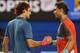 MELBOURNE, AUSTRALIA - JANUARY 24: Rafael Nadal of Spain shakes hands with Roger Federer of Switzerland after Nadal won their semifinal match during day 12 of the 2014 Australian Open at Melbourne Park on January 24, 2014 in Melbourne, Australia. (Photo by Mark Kolbe/Getty Images)