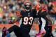 Cincinnati Bengals defensive end Michael Johnson (93) celebrates with defensive end Carlos Dunlap after sacking Miami Dolphins quarterback Ryan Tannehill in the first half of an NFL football game on Sunday, Oct. 7, 2012, in Cincinnati. (AP Photo/Michael Keating)