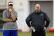 Buffalo Bills' head coach Doug Marrone, left, and defensive coordinator Mike Pettine, right, watch the rookie minicamp at the team's NFL football training facility in Orchard Park, N.Y., Friday, May 10, 2013. (AP Photo/Bill Wippert)
