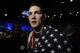 Chris Weidman, of Baldwin, N.Y., walks after defeating Anderson Silva, of Brazil, during the UFC 168 mixed martial arts middleweight championship bout on Saturday, Dec. 28, 2013, in Las Vegas. Weidman won during the second round by a technical knockout after Silva was injured. (AP Photo/David Becker)