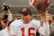 San Francisco 49ers quarterback Joe Montana raises his helmet toward the crowd as he leaves the field following the team's 55-10 victory over the Denver Broncos in the Super Bowl in New Orleans, La., Jan. 28, 1990. (AP Photo/Lennox McLennon)
