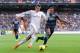 MADRID, SPAIN - JANUARY 25: Gareth Bale (L) of Real Madrid CF tries to outrun Brayan Angulo of Granada CF during the La Liga match between Real Madrid CF and Granada CF at Santiago Bernabeu stadium on January 25, 2014 in Madrid, Spain. (Photo by Denis Doyle/Getty Images)