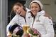 Elana Meyers and Lolo Jones of the USA, from right, pose for photographers after their second place in the women's Bobsled World Cup race in Winterberg, Germany, on Sunday, Jan. 5, 2014. (AP Photo/Martin Meissner)