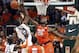 Syracuse's Rakeem Christmas (25) blocks Miami's Erik Swoope (21) during the first half of an NCAA college basketball game in Coral Gables, Fla., Saturday, Jan. 25, 2014. (AP Photo/J Pat Carter)