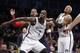 Brooklyn Nets forward Kevin Garnett (2) and Nets forward Paul Pierce (34) defend Detroit Pistons forward Greg Monroe (10) in the second half of an NBA basketball game, Sunday, Nov. 24, 2013, in New York. The Pistons won 109-97. (AP Photo/Kathy Willens)