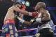 Manny Pacquiao, left, and Timothy Bradley exchange punches in the 12th round of their WBO world welterweight title fight Saturday, June 9, 2012, in Las Vegas. Bradley won by split decision. (AP Photo/Julie Jacobson)