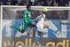 Marseille's Ghanaian forward Andre Ayew, right, scores despite Saint-Etienne's French defender Kurt Zouma, during their League One soccer match, in Marseille, southern France, Sunday, Dec. 23, 2012. (AP Photo/Claude Paris)