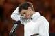 Rafael Nadal of Spain reacts as he speaks during the trophy presentation, after his loss to Stanislas Wawrinka of Switzerland in the men's singles final at the Australian Open tennis championship in Melbourne, Australia, Sunday, Jan. 26, 2014.(AP Photo/Andrew Brownbill)