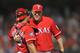 ARLINGTON, TX - JUNE 26: Joe Nathan #36 of the Texas Rangers is congratulated by catcher Yorvit Torrealba #8 after getting the save in a 7-5 victory against the Detroit Tigers on June 26, 2012 at the Rangers Ballpark in Arlington, Texas. (Photo by Layne Murdoch/Getty Images)