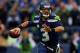 SEATTLE, WA - JANUARY 19: Quarterback Russell Wilson #3 of the Seattle Seahawks looks to pass in the first quarter against the San Francisco 49ers during the 2014 NFC Championship at CenturyLink Field on January 19, 2014 in Seattle, Washington. (Photo by Ronald Martinez/Getty Images)