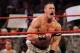 John Cena, right, and Mark Henry perform during WWE’s 9th annual