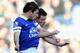 LIVERPOOL, ENGLAND - DECEMBER 29: Leighton Baines of Everton goes up for a header with Steven Davis of Southampton during the Barclays Premier League match between Everton and Southampton at Goodison Park on December 29, 2013 in Liverpool, England. (Photo by Clive Brunskill/Getty Images)