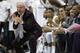 North Carolina coach Roy Williams, left, reacts following a play against Kentucky during the second half of an NCAA college basketball game in Chapel Hill, N.C., Saturday, Dec. 14, 2013. North Carolina won 82-77. (AP Photo/Gerry Broome)