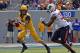 West Virginia quarterback Clint Trickett (9) avoids the pass rush in the third quarter of an NCAA college football game against Oklahoma State in Morgantown, W.Va., on Saturday, Sept. 28, 2013. (AP Photo/Tyler Evert)