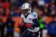 DENVER, CO - DECEMBER 8: Running back Chris Johnson #28 of the Tennessee Titans runs with the ball against the Denver Broncos at Sports Authority Field Field at Mile High on December 8, 2013 in Denver, Colorado. The Broncos defeated the Titans 51-28. (Photo by Justin Edmonds/Getty Images)