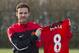Manchester United's new signing Juan Mata displays his new shirt before a press conference at the team's Carrington training ground, Manchester, England, Monday, Jan. 27, 2014. With Manchester United in danger of missing out on the Champions League next season, Juan Mata's arrival at Old Trafford for a club record fee of 37.1 million pounds ($61.2 million) is certainly an emergency move. But it also marks the first step in the rebuilding process of England's most titled club. After a botched transfer campaign last summer that was followed by the club's lackluster first half of the season, United now looks determined to allow manager David Moyes the opportunity to build his own team.(AP Photo/Jon Super)