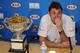 Stanislas Wawrinka of Switzerland speaks next to the trophy, during a press conference after defeating Rafael Nadal of Spain in the men's singles final at the Australian Open tennis championship in Melbourne, Australia, Sunday, Jan. 26, 2014.(AP Photo/Andrew Brownbill)
