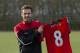 Manchester United's new signing Juan Mata displays his new shirt before a press conference at the team's Carrington training ground, Manchester, England, Monday, Jan. 27, 2014. With Manchester United in danger of missing out on the Champions League next season, Juan Mata's arrival at Old Trafford for a club record fee of 37.1 million pounds ($61.2 million) is certainly an emergency move. But it also marks the first step in the rebuilding process of England's most titled club. After a botched transfer campaign last summer that was followed by the club's lackluster first half of the season, United now looks determined to allow manager David Moyes the opportunity to build his own team.(AP Photo/Jon Super)