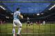 Manchester City's Sergio Aguero, centre left, gathers the ball from the net after a goal by teammate Yaya Toure, bottom third right, during their 4-2 win against Cardiff City in their English Premier League soccer match at the Etihad Stadium, Manchester, England, Saturday Jan 18, 2014. (AP Photo/Jon Super)