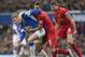 Everton's Gerard Deulofeu, left, fights for the ball against Liverpool's Daniel Agger, centre, as Steven Gerrard looks on during their English Premier League soccer match at Goodison Park Stadium, Liverpool, England, Saturday Nov. 23, 2013. (AP Photo/Jon Super)