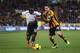 HULL, ENGLAND - DECEMBER 01: Victor Moses of Liverpool is tackled by Robert Koren of Hull City during the Barclays Premier League match between Hull City and Liverpool at KC Stadium on December 1, 2013 in Hull, England. (Photo by Jamie McDonald/Getty Images)