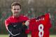 Juan Mata shows off the No. 8 shirt he will wear for Manchester United.