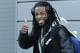 Seattle Seahawks cornerback Richard Sherman gives a thumbs-up as he leaves team's headquarters, Sunday, Jan. 26, 2014, in Renton, Wash., to board a bus for his flight to play the Denver Broncos in the NFL Super Bowl XLVIII football game in East Rutherford, N.J. (AP Photo/Ted S. Warren)