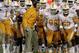 Tennessee coach Butch Jones, center, sends his team ontp the field in the fourth quarter against Kentucky in an NCAA college football game in Lexington, Ky., Saturday, Nov. 30, 2013. Tennessee won 27-14. (AP Photo/Garry Jones)