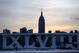 The Empire State Building, top, backdrops Roman numerals for the NFL Super Bowl XLVIII football game during sunrise at Pier A Park in Hoboken, N.J., Tuesday, Jan. 28, 2014. The Seattle Seahawks and the Denver Broncos are scheduled to play on Sunday, Feb. 2, 2014, at MetLife Stadium in East Rutherford, N.J. (AP Photo/Julio Cortez)