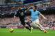 MANCHESTER, ENGLAND - NOVEMBER 24: Alvaro Negredo of Manchester City challenges Kyle Walker of Tottenham Hotspur during the Barclays Premier League match between Manchester City and Tottenham Hotspur at Etihad Stadium on November 24, 2013 in Manchester, England. (Photo by Jamie McDonald/Getty Images)