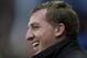 Liverpool's manager Brendan Rodgers smiles before his team's 5-3 win against Stoke in their English Premier League soccer match at the Britannia Stadium, Stoke, England, Sunday Jan 12, 2014. (AP Photo/Jon Super)