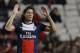 PSG's Edinson Cavani, left raises his hands after scoring the opening goal during a Group C Champions League soccer match between Benfica and PSG at the Luz stadium in Lisbon, Tuesday Dec. 10, 2013.(AP Photo/Armando Franca)