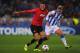 Antoine Griezmann gives Manchester United's Chris Smalling a hard time.